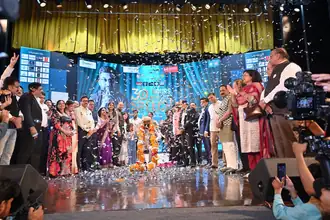 Confetti celebration on stage after the 30-hour non-stop speech